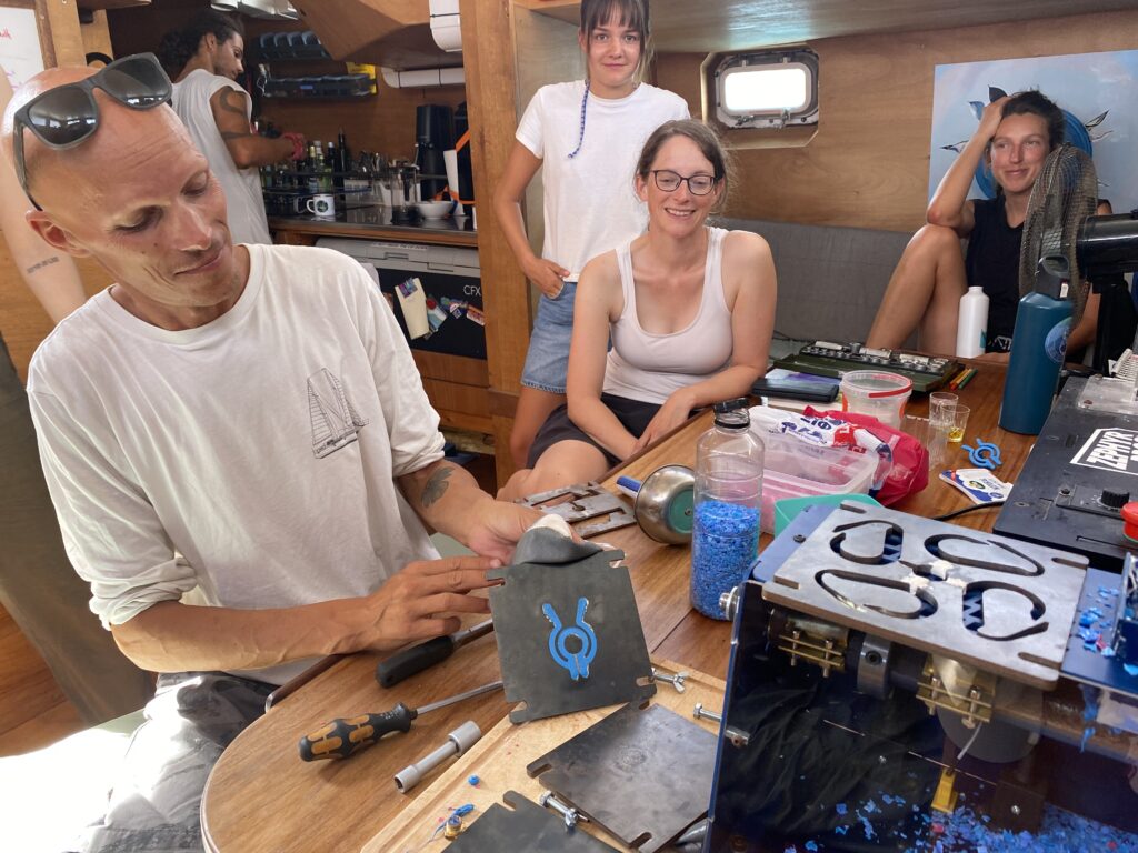 recycling plastic on a sailboat making clothe pin